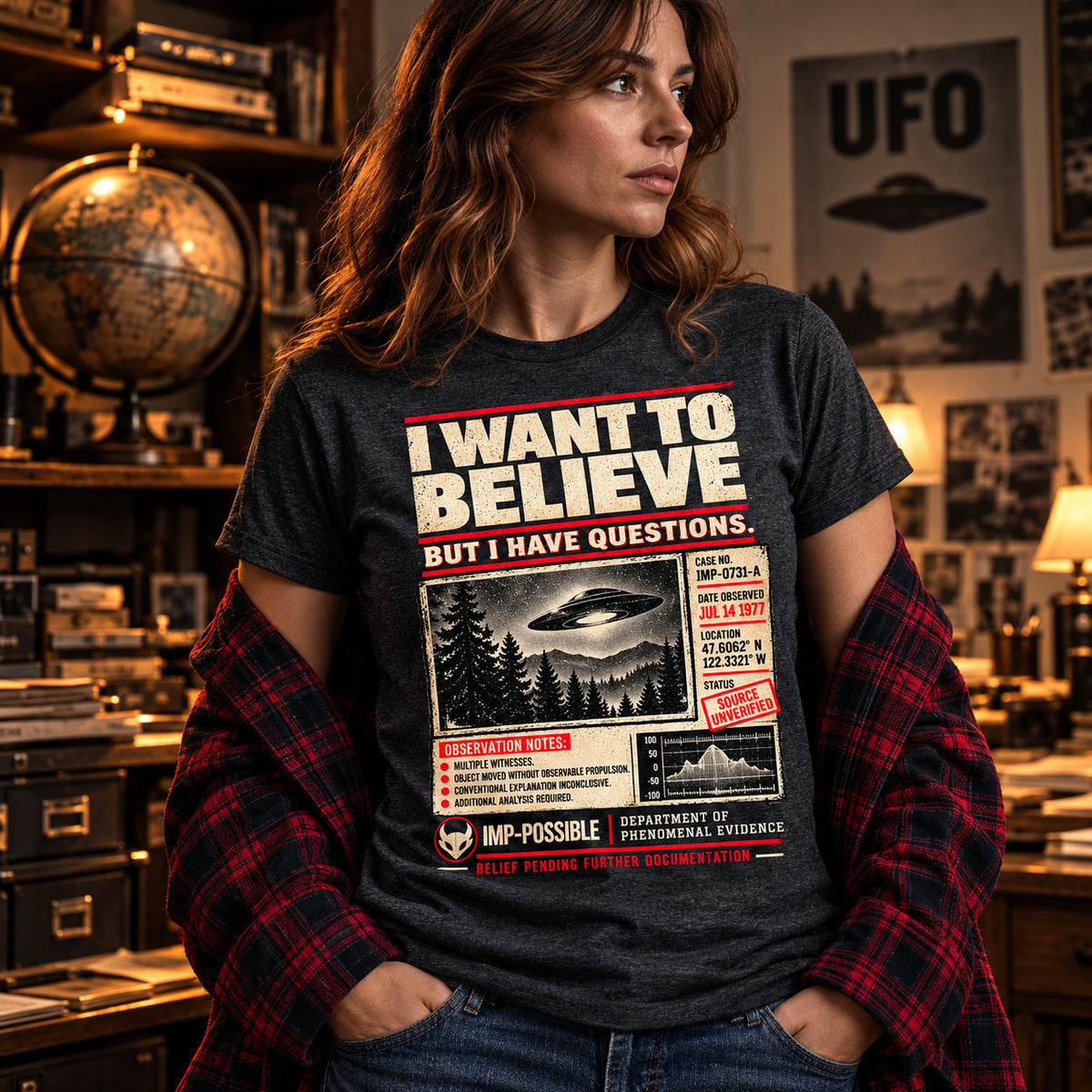 Model wearing the dark heather I Want to Believe UFO graphic T-shirt.
