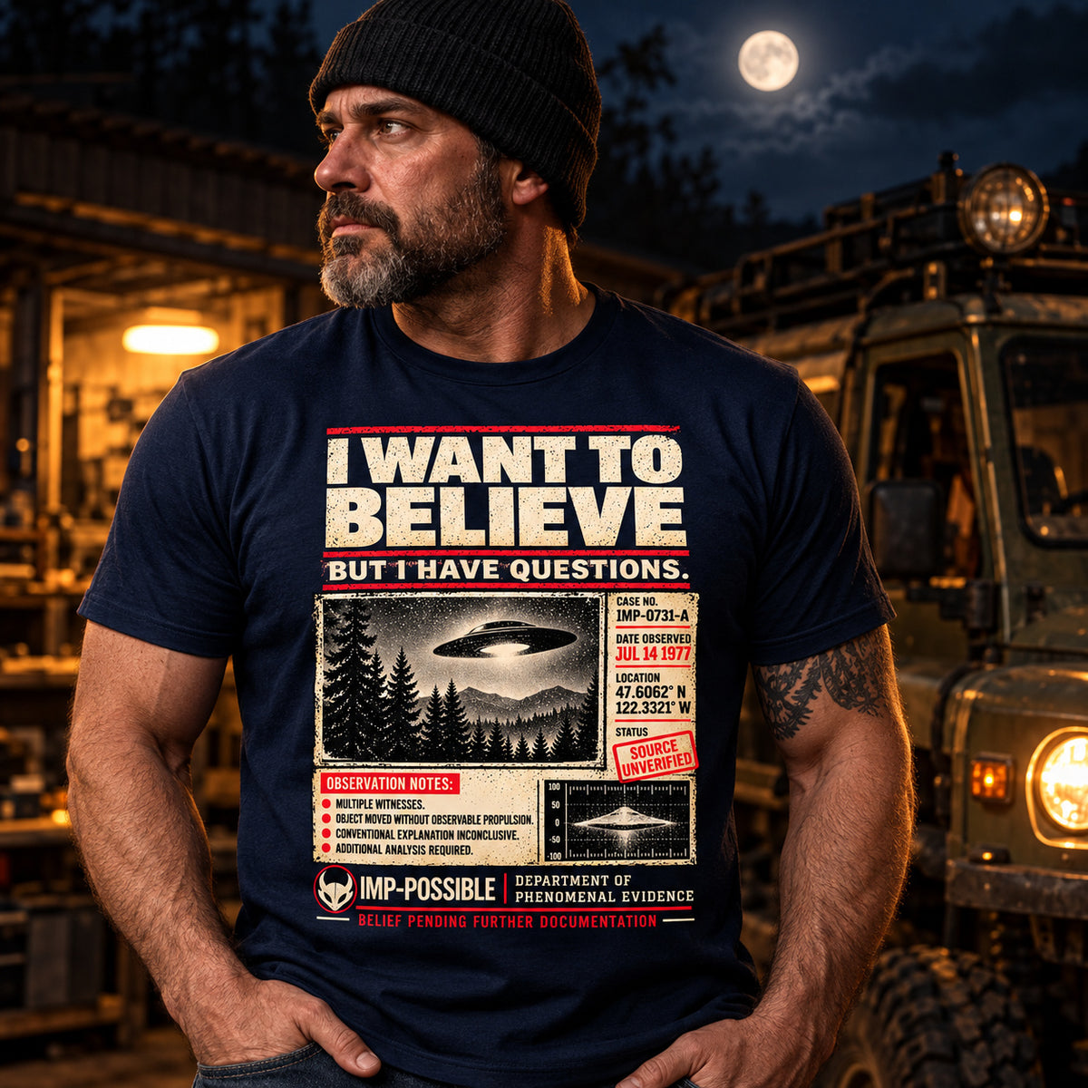 Model wearing the navy I Want to Believe UFO graphic T-shirt.
