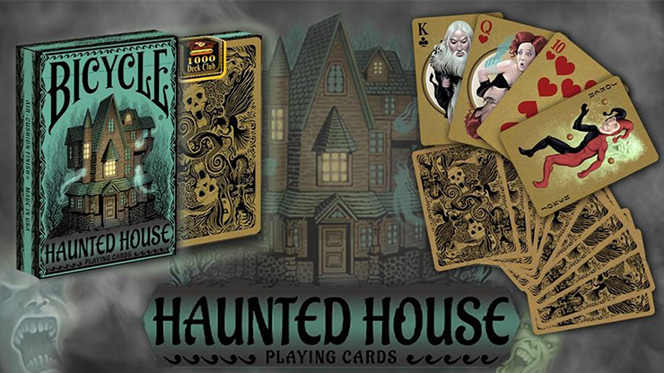 Bicycle Haunted House playing cards with packaging and cards displayed in front of a haunted house illustration.