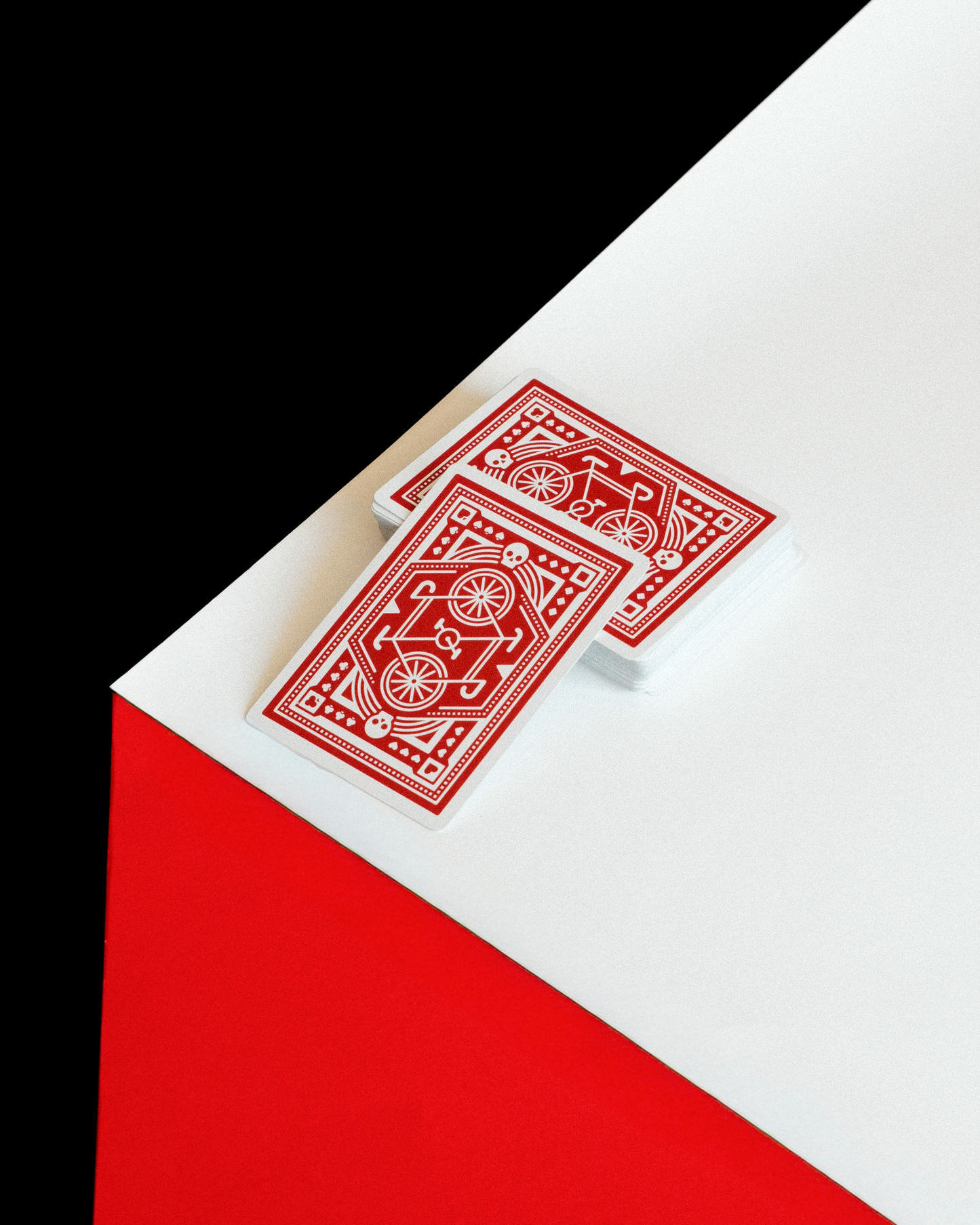 DKNG Red Wheels playing cards geometric red and white deck design