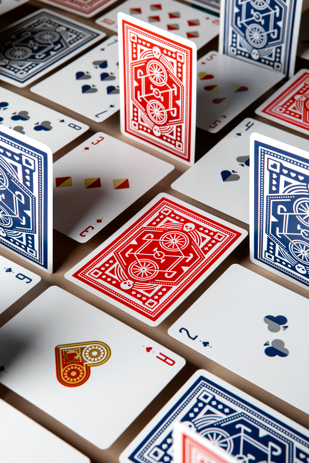 DKNG Red Wheels playing cards spread showing geometric back pattern and card layout