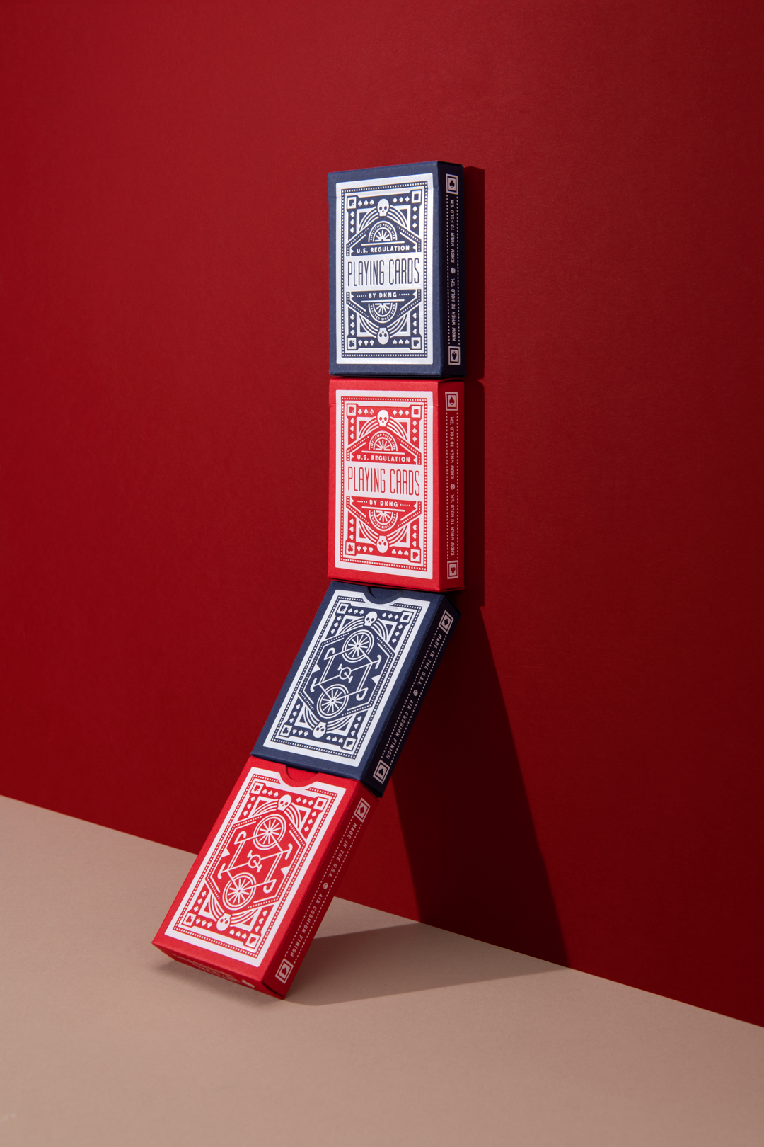 DKNG Red Wheels playing cards spread showing geometric back pattern and card layout
