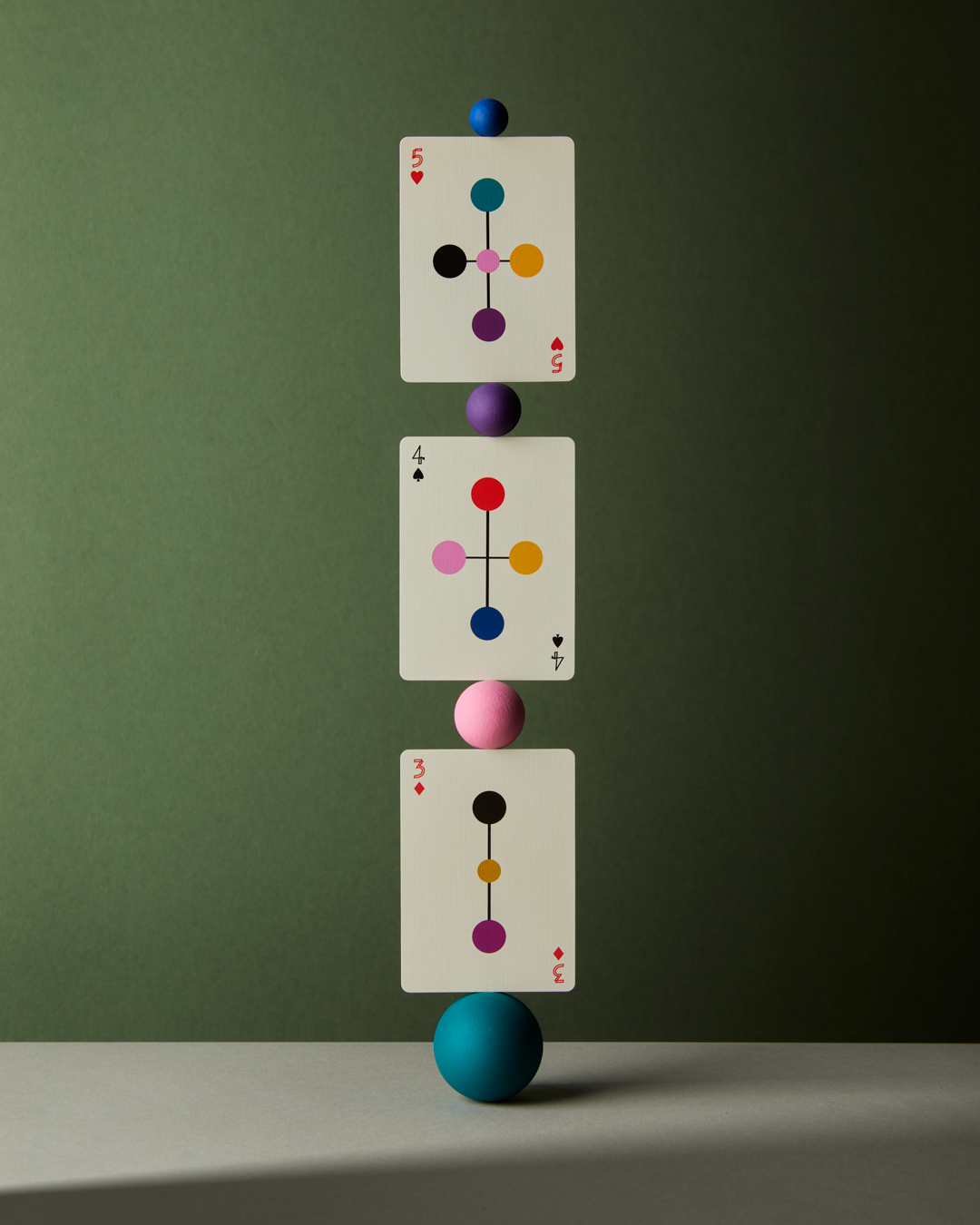 Close-up of Eames playing cards showing numbered court system from 1 to 13