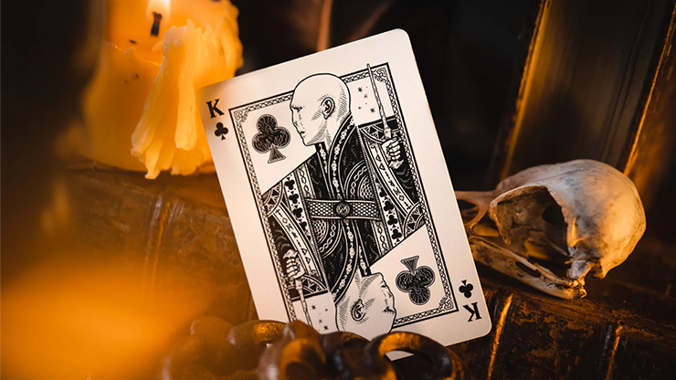 Harry Potter playing card king design from theory11 Wizarding World deck displayed with candles and skull on dark magical setting