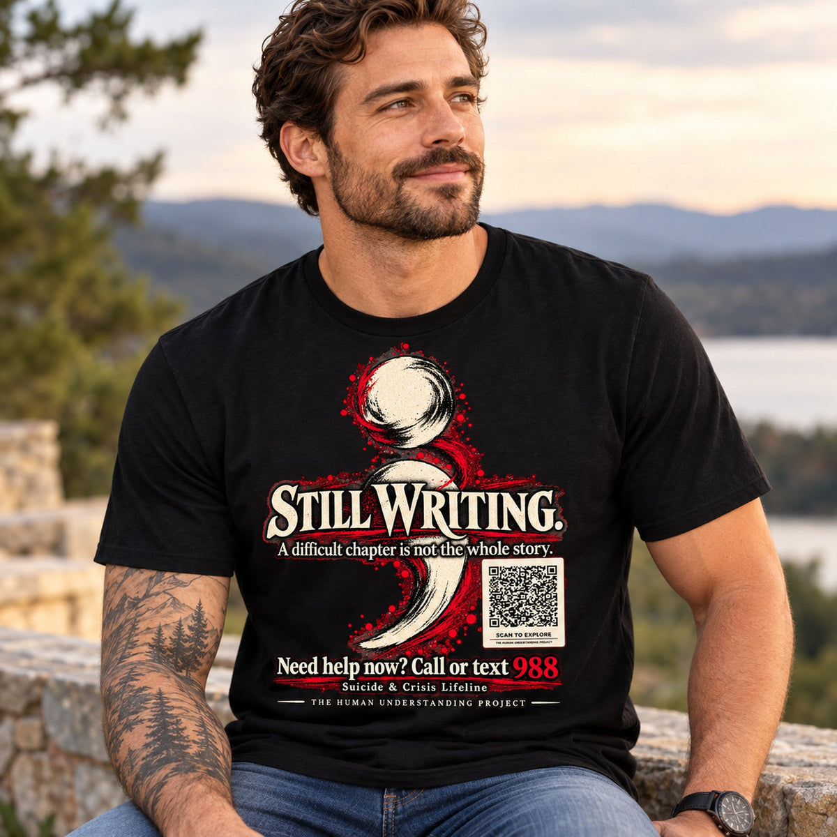 Man outdoors wearing black Still Writing semicolon mental health awareness shirt with prominent 988 support message; AI lifestyle mockup.