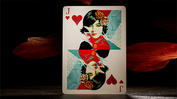Jack of Hearts card from Obey Collage Edition playing cards by theory11 featuring Shepard Fairey collage-style artwork displayed on a dark tabletop background