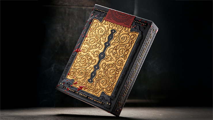 Peaky Blinders playing cards by theory11 collector deck tuck case with ornate antique gold foil design displayed on a dark cinematic background