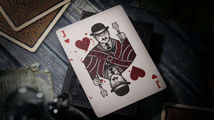 Jack of Hearts character card from Peaky Blinders playing cards by theory11 featuring a vintage gangster design on a dark wooden table with ornate card backs