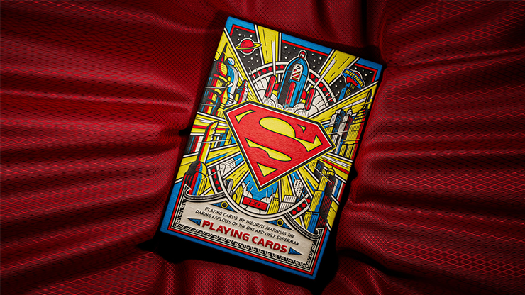 Superman playing cards by theory11 DC collector deck featuring vintage comic style tuck case with Superman logo displayed on red fabric background