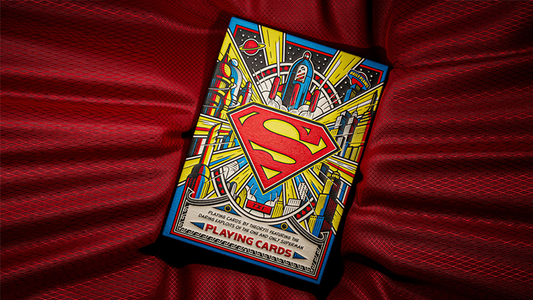 Superman playing cards by theory11 DC collector deck featuring vintage comic style tuck case with Superman logo displayed on red fabric background